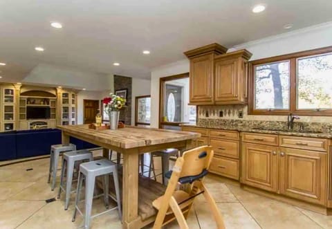 [Kitchen] The Island Offers Lots of Counter Space, Perfect for Cooking/Serving a Crowd and Has a High Chair so your Little Ones can Help Cook too!