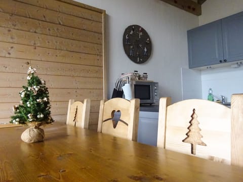 Large dining area for 6 persons with authentic Savoie wooden furniture.