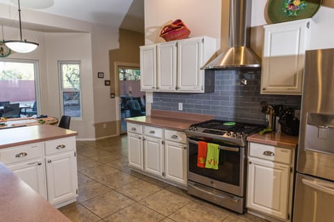 Gourmet kitchen with gas stove, new refrigerator