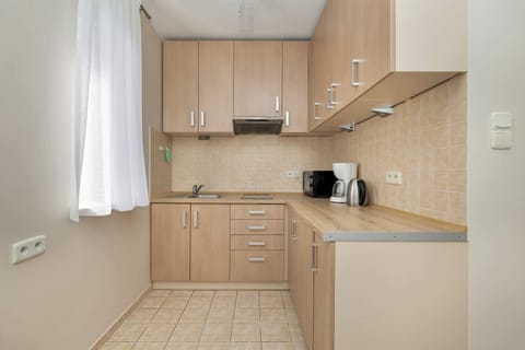 Bright, functional kitchenette with high-quality appliances.