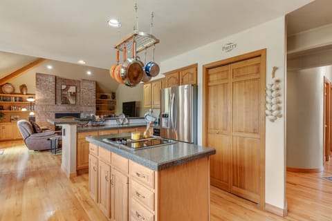 Kitchen adjacent to family room; large pantry, refrigerator and flat top stove.