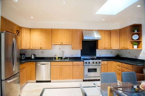 Large custom kitchen with Italian granite counter and marble floor