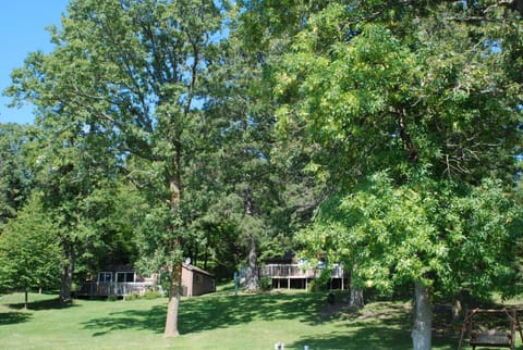 This cabin is on the right in this photo. nestled in the trees with lake view