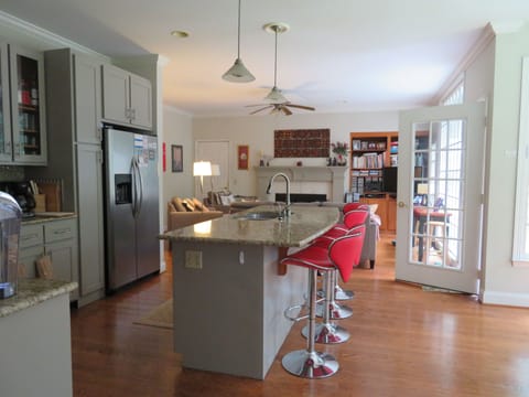 open plan kitchen, breakfast nook to right 
