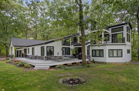 Front and east side of house with fire pit.