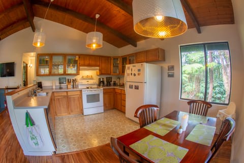 Another angle of the dining area and fully stocked kitchen