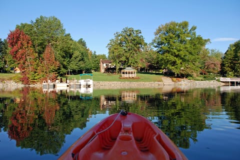 Back yard w/dock & gazebo as seen from the lake in the fall.