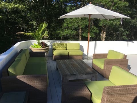 outsid deck seating overlooking private outdoor lounging area