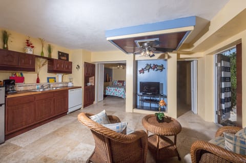 Beach Walk's lower
mini Great Room includes tv, microwave, fridge, and more!