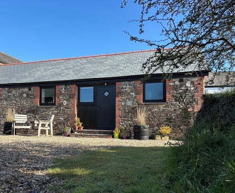 Private sunny area, large planter, bird feeders + parking to front of Barn