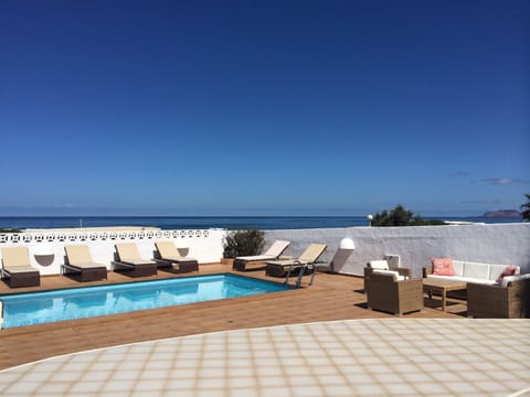 Pool area overlooking the Famara Beach 