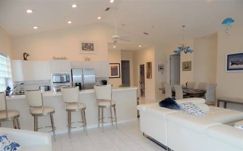 Upper Level: Kitchen, Living and Dining Rooms.