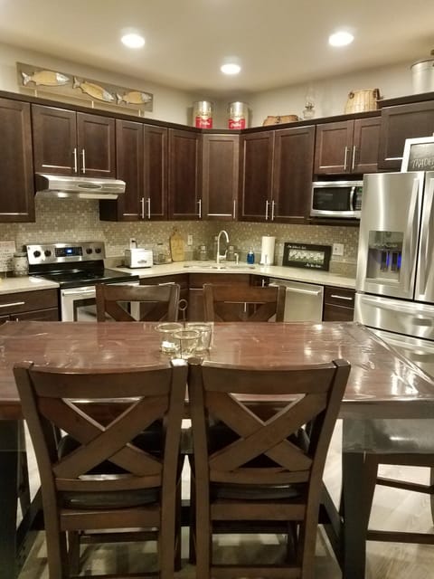 Modern kitchen, stainless appliances.