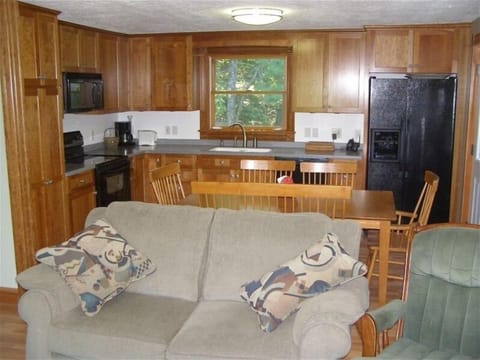 Gather round, make memories worth remembering in warm, spacious cherry kitchen.
