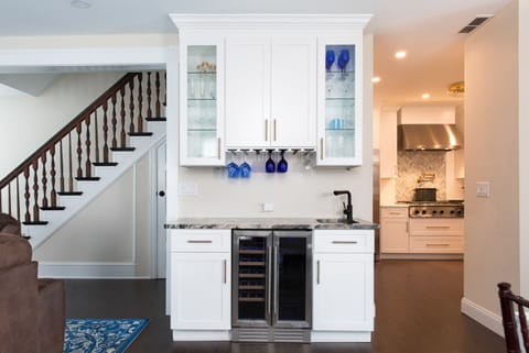 I LOVE this bar! It looks great, ADDS features and reduced traffic into kitchen.