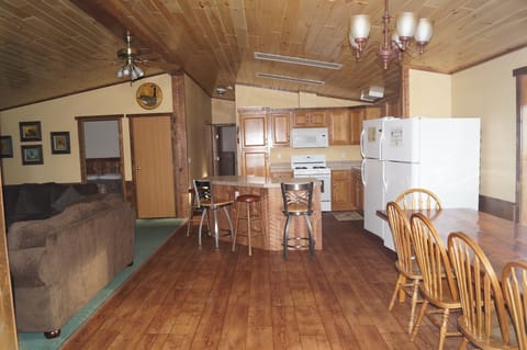 Large kitchen/dining area. Has two refrigerators.