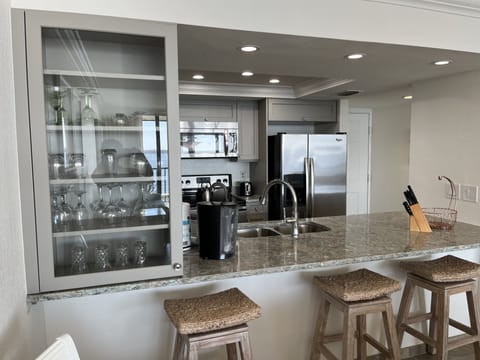 Kitchen fully renovated (January 2023) with glass  cabinet and counter seating 