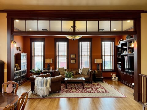Living room -- with a smart TV and built in surround sound --overlooks Main St.