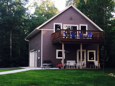Front of house with oversized deck facing the lake.