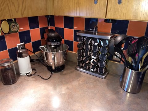 Complete kitchen appliances and spice stock.