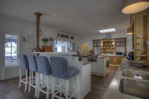 Super large gourmet and entertainers kitchen, opening to patio, pool and garden