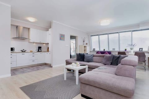 Living room with a comfortable sofa and TV. 