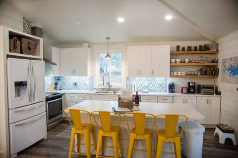 Kitchen on main level, includes a microwave drawer in kitchen island