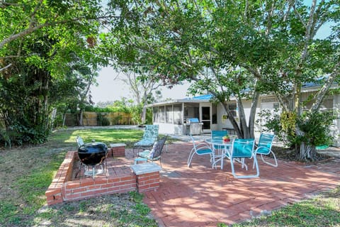 Totally fenced 110'x40' backyard with shaded conversation and dining areas. 