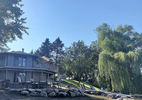 Lake home overlooking fire pit and beach fun.