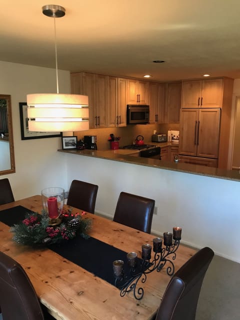 Dining Table looking into Kitchen. Bar Seating for 4 people