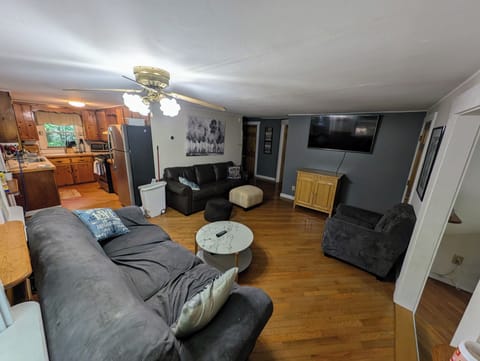 Open living space flows into kitchen, perfect for family gatherings.