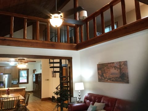 Dramatic open area to the living room. Watch the small ones Around the railing  