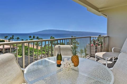 Beautiful oceanfront balcony with views of a tropical coastline and a distant island