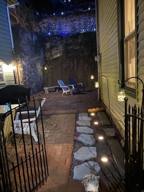 fully fenced in backyard with doggy door leading to it 