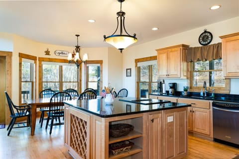 Spacious kitchen with stainless steel appliances and granite counter tops.