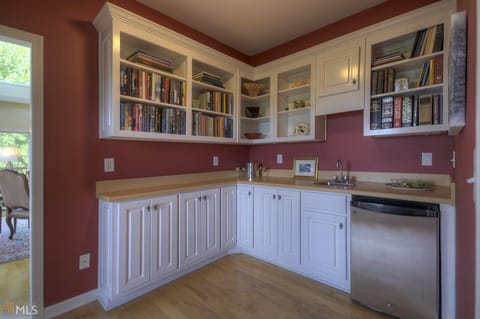 Main floor Library/Study with books, mini fridge and board games.