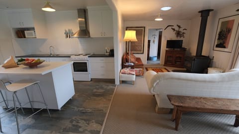 Open plan living and dining with views to front and back gardens.