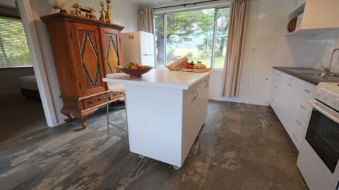 Enjoy drinks on the island bar while cooking in our new kitchen. Love the slate!
