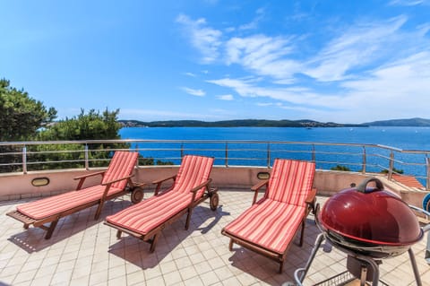 Balcony includes 4 sun loungers and BBQ