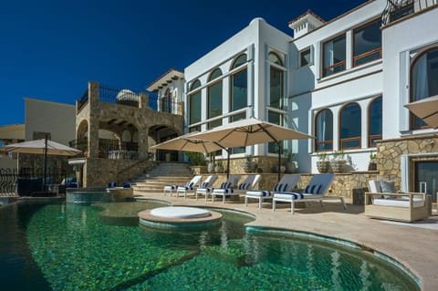 Infinity pool, loungers and stone facade at Casa Rio de Luna, Rancho Cerro Colorado, Los Cabos.