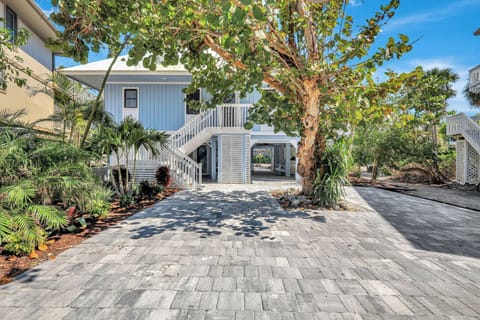 Front view of our newly remodeled  home w/ new pavers and landscaping.