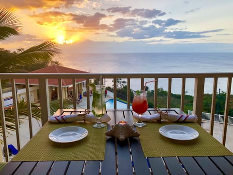 Enjoy a Refreshing Cocktail while watching the Amazing Sunset from our Balcony
