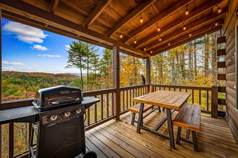 Outdoor seating for 6 people with gas grill and back up propane tanks.
