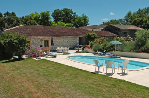 swimming pool and back of gites