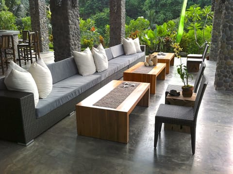 Large seating area in Great Room overlooking the pool and river canyon gardens.