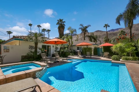 View of pool and house from corner of yard