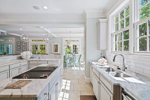Newly remodeled, long view to the breakfast nook and screen in porch area