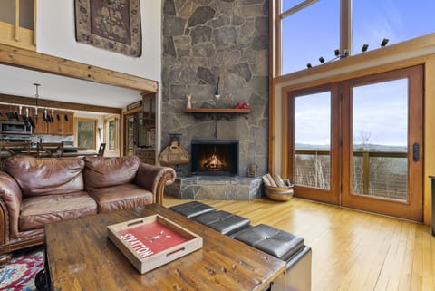 Enjoy the 26ft fireplace with a view!