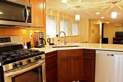 Full kitchen with gas stove, dishwasher, microwave, and fridge.     Coffee maker