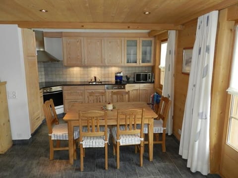 Cabinetry, Table, Furniture, Countertop, Wood, Window, Building, Kitchen, Flooring, Wood Stain